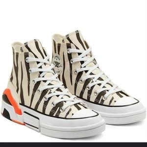 SOLD.   Converse Zebra Sun Blocked High Tops